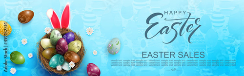 Blue illustration with Easter eggs in a nest and rabbit ears