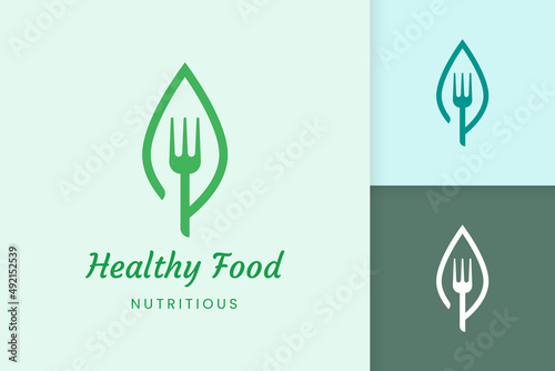 healthy food logo with fork and leaf shape