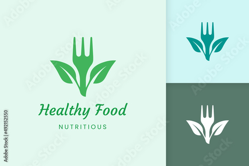 healthy food logo with fork and leaf shape
