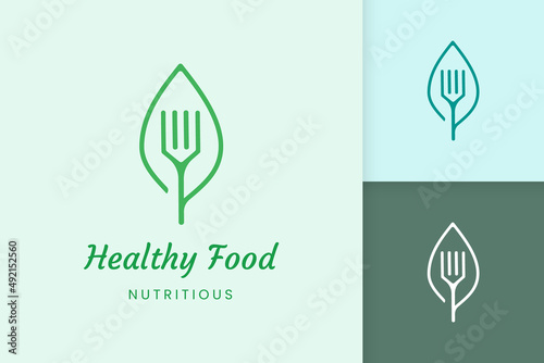 healthy food logo with fork and leaf shape