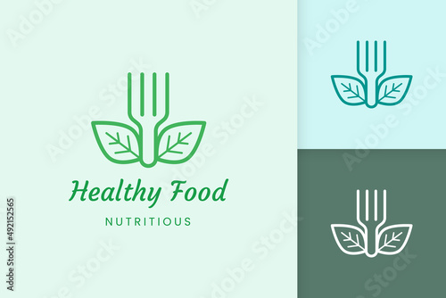healthy food logo with fork and leaf shape