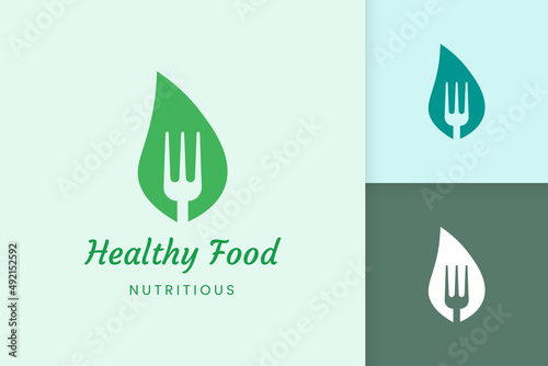 healthy food logo with fork and leaf shape