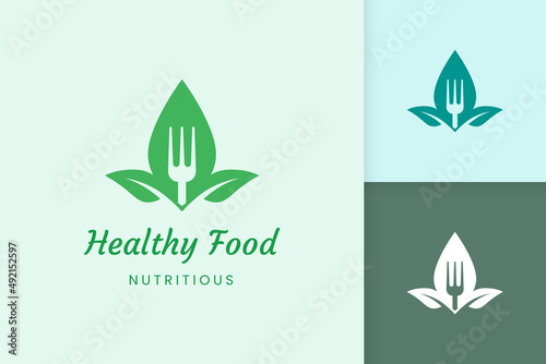 healthy food logo with fork and leaf shape