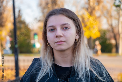 portrait of a beautiful European girl with loose hair against the background of nature. selective focus.