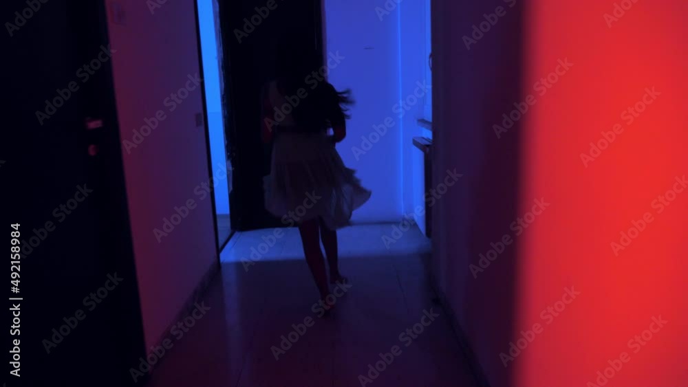 danger, fear - scared indian woman runs in the dark to escape an assault