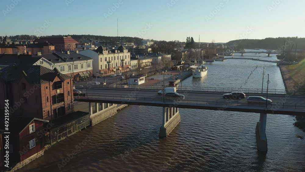Porvoo.Finland-December 12.2020: Aerial survey of the cars crossing the bridge in Porvoo Finland in the Northern riverside city with clear blue sky in late autumn Porvoo.Finland-December 12.2020: Aerial survey of the cars crossing the bridge in Porvoo Finland in the Northern riverside city with clear blue sky in late autumn