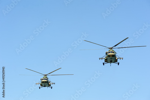 Russian military helicopter MI-8 in the cloudy sky