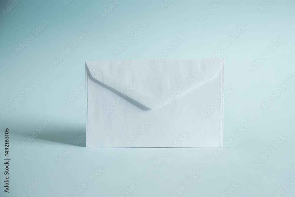 a white envelope on a blue background, send a message, or a news item.