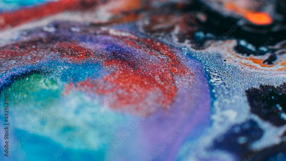 Fototapeta premium Ink blend. Artistic hobby. Colorful abstract bakgrund. Purple lavender pink blue glitter paints mix