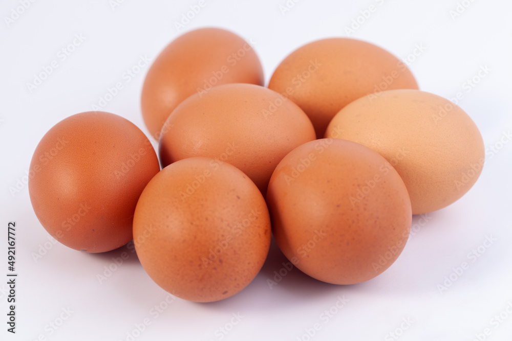 seven eggs are placed on a white background with free space on right seven eggs are placed on a white background with free space on right