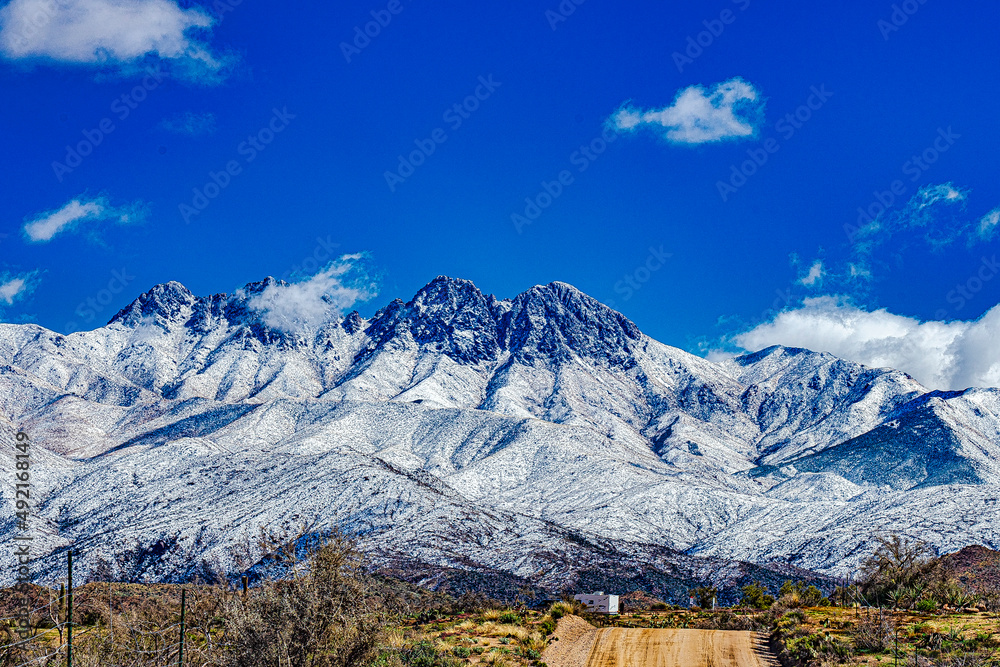 The road leads to the Mazatal Mountains in Arizona covered with snow