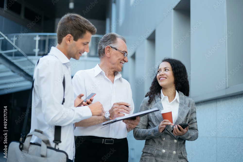 businessman discussing new clauses of the contract with his colleagues. businessman discussing new clauses of the contract with his colleagues.