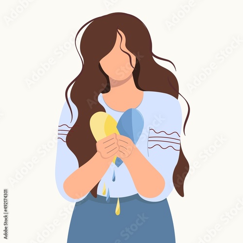Ukrainian girl with the heart of Ukraine in her hands. Sad woman mourns. Concept of grief, pain, loss, death for banner design, landing page. Flat isolated vector design. Light background. No war.
