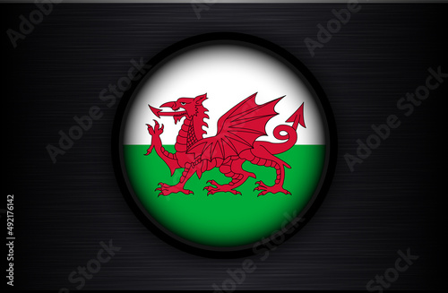 Wales flag circle icon on black brushed metal texture, Welsh dragon on black background, vector design.