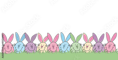 Osterkarte bunte Hasen Gruppe als Osternest im Rasen, fröhliche Osterhasen Landschaft, 
