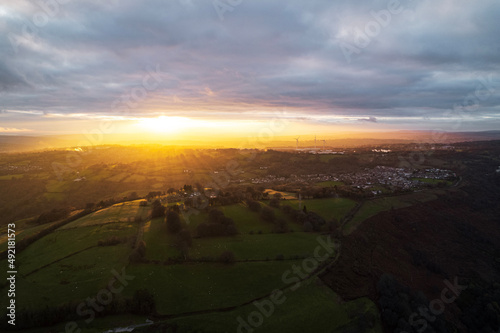 aerial view of town sunset and wind turbines