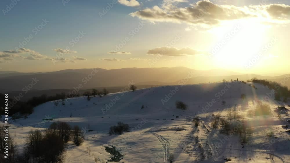 Aerial view at the mountain on a sunset of the winter day Aerial view at the mountain on a sunset of the winter day