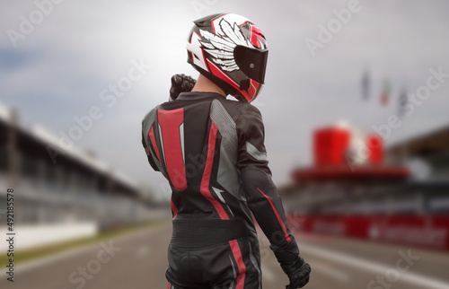 Motorcyclist in full gear and helmet on the race track © OB production