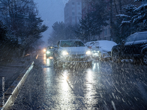 car light in blizzard, front view photo