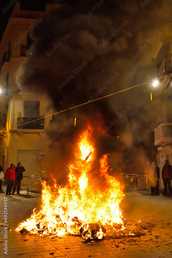 Valencia, Spain: 03.20.2019; The fire of burned falla on the street of Valencia