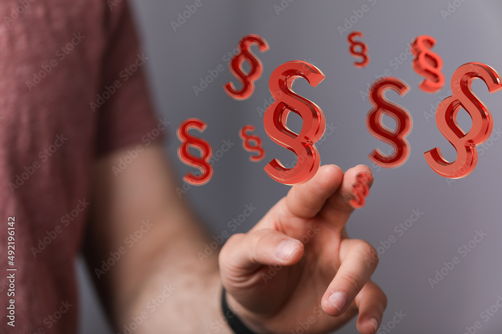 Hand mit Paragraf