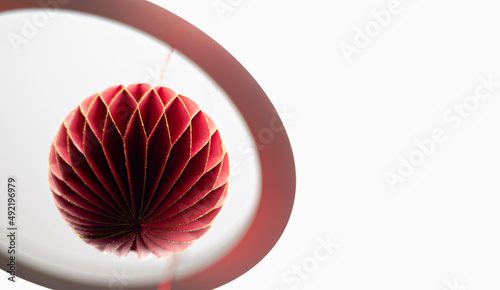 Red Christmas ball on light background
