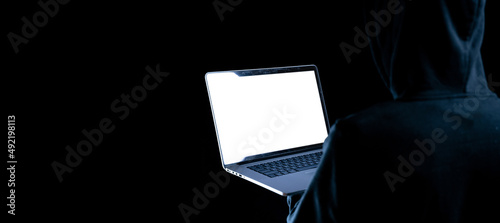 Fototapeta Naklejka Na Ścianę i Meble -  Hacker security cyber attack. Digital laptop in hacker man hand isolated on black. Internet web hack technology. Login and password, cybersecurity banner concept.