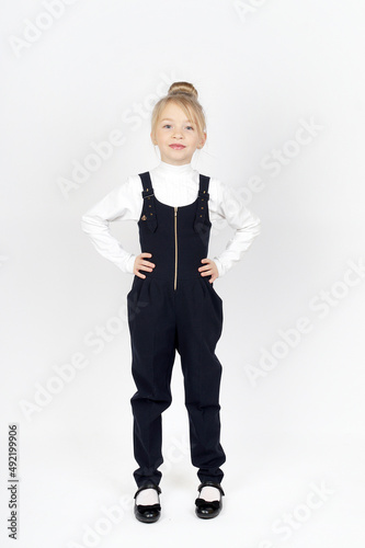 little girl posing in school uniform