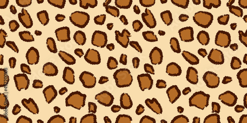 Seamless leopard fur pattern. Fashionable wild leopard print background. Stylish vector orange and brown illustration