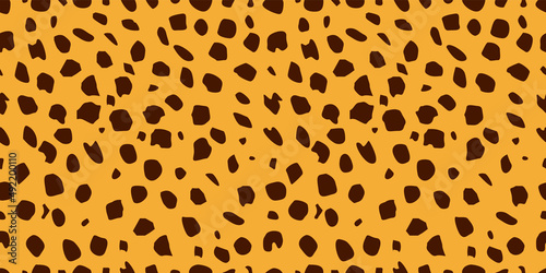 Seamless leopard fur pattern. Fashionable wild leopard print background. Stylish vector yellow and brown illustration