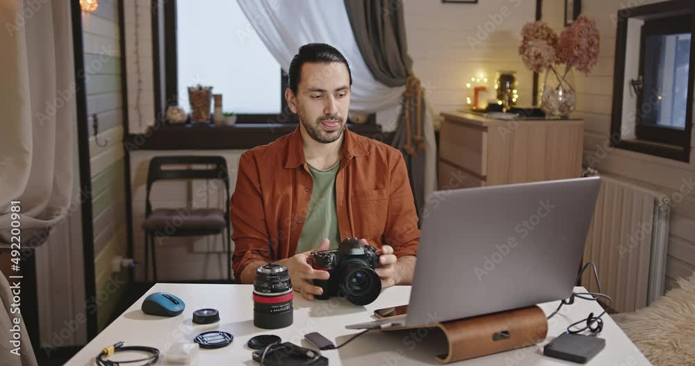 Young handsome man make technique review and webinar lecture for photographers. Young handsome man make technique review and webinar lecture for photographers.
