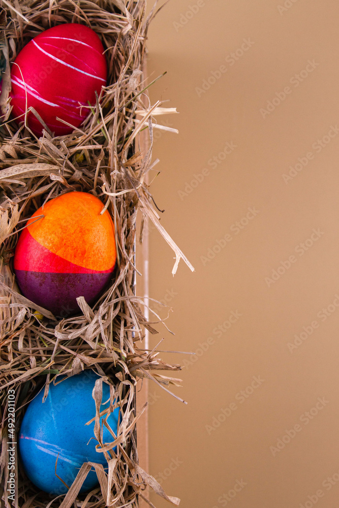 Easter eggs. Festive decoration. Easter. Celebration. Bright holiday. Eggs on a beige background. Multi-colored eggs on a beige background. Easter eggs. Festive decoration. Easter. Celebration. Bright holiday. Eggs on a beige background. Multi-colored eggs on a beige background.