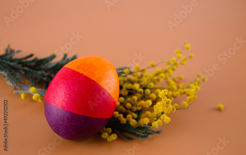 Easter eggs. Festive decoration. Easter. Celebration. Bright holiday. Eggs on an orange background. Multi-colored eggs on an orange background.