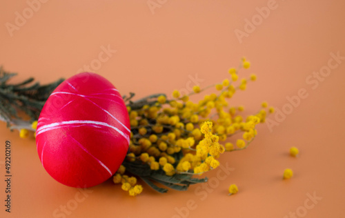 Easter eggs. Festive decoration. Easter. Celebration. Bright holiday. Eggs on an orange background. Multi-colored eggs on an orange background.
