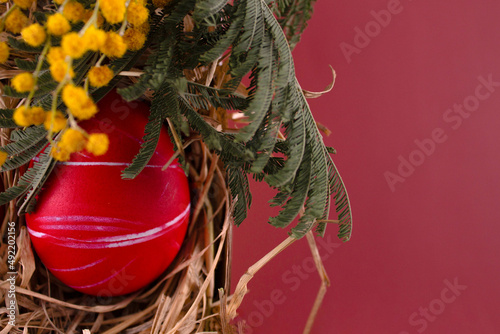 Easter eggs. Festive decoration. Easter. Celebration. Bright holiday. Eggs on a red background. Multi-colored eggs on a red background.