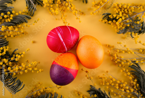 Easter. Yatsa. Easter eggs on a yellow background. Yellow background. Bright holiday of Easter. Painted Easter eggs. colored eggs