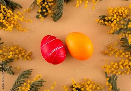 Easter eggs. Festive decoration. Easter. Celebration. Bright holiday. Eggs on an orange background. Multi-colored eggs on an orange background.