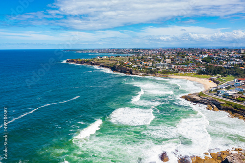 Fototapeta Naklejka Na Ścianę i Meble -  Aerial drone view of iconic Bronte Beach and nearby coastline in Sydney, Australia during summer on a sunny day  