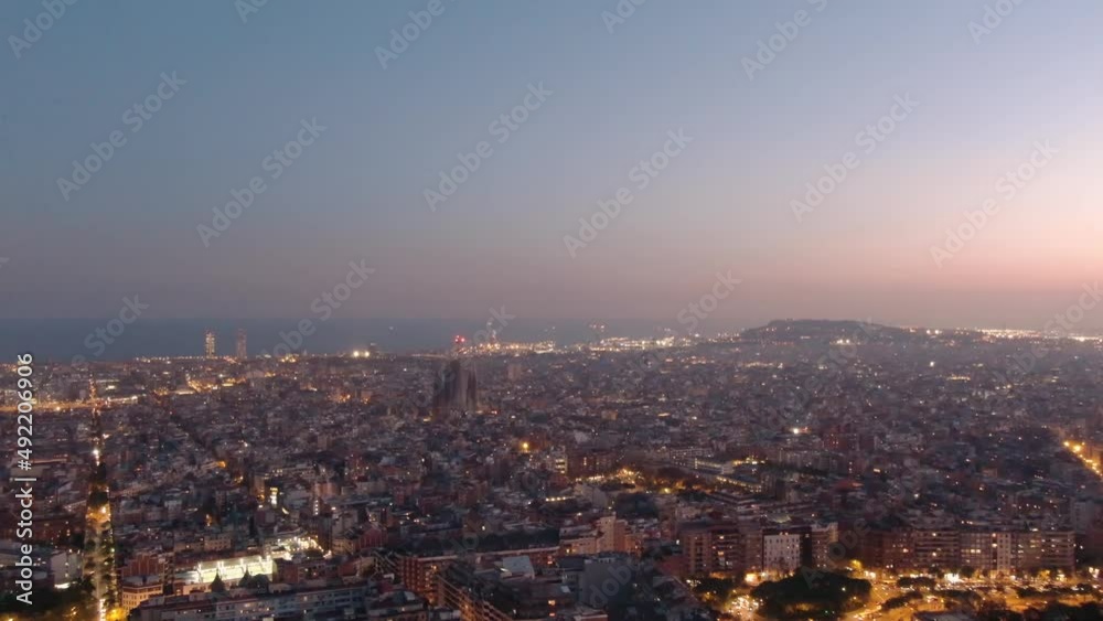Aerial Drone Panoramic View Of Sagrada Familia Cathedral And Barcelona Skyline At Dusk Aerial Drone Panoramic View Of Sagrada Familia Cathedral And Barcelona Skyline At Dusk