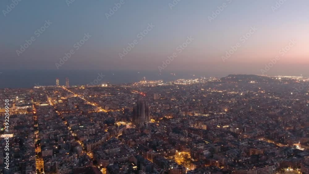 Establishing Aerial View Of Sagrada Familia Cathedral And Barcelona Skyline At Dusk Establishing Aerial View Of Sagrada Familia Cathedral And Barcelona Skyline At Dusk