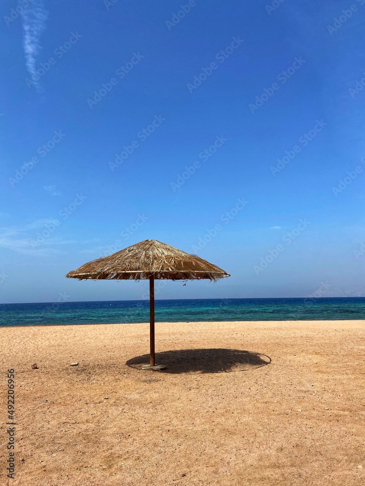View of the beach and umbrella in Jordan, Red Sea