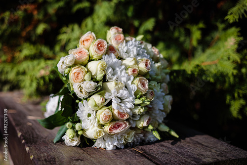 Bouquet of fresh bright flowers. Holiday decor. Accessories for the bride on the wedding day