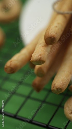 Close-up: Italian pastries on a lattice pattern, Italian bread sticks photo