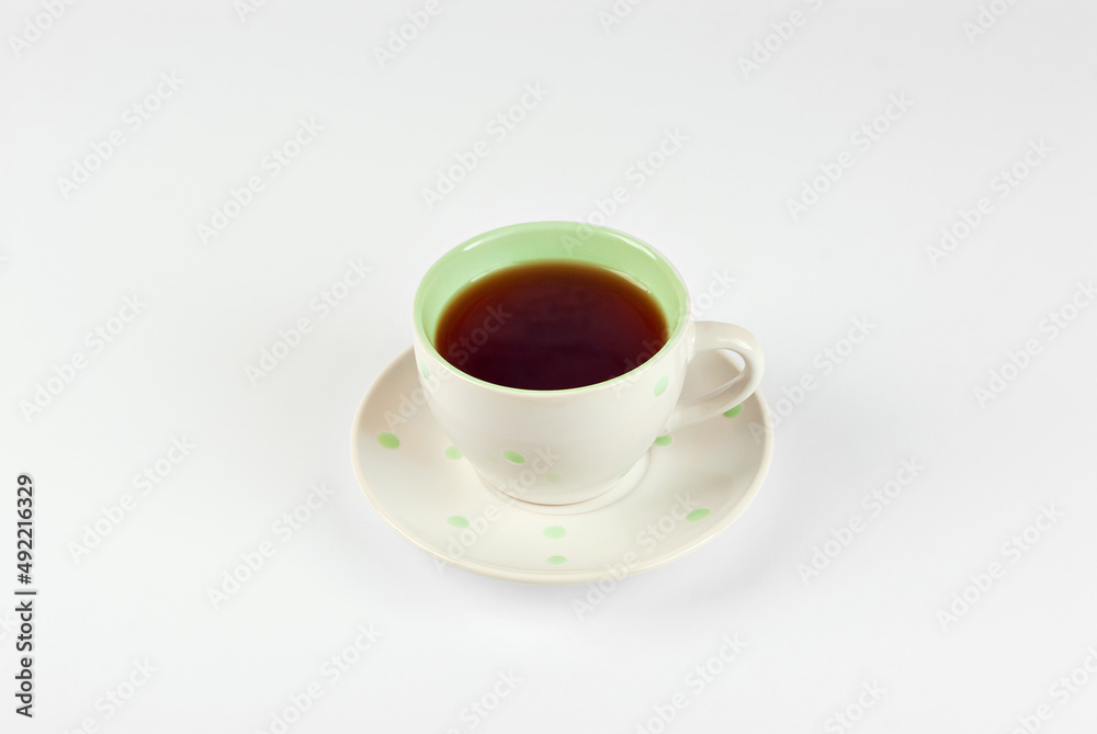 Ceramic coffee mug close up. Coffee isolated on a white background. Copy space and free space for text near the drink. Ceramic coffee mug close up. Coffee isolated on a white background. Copy space and free space for text near the drink.