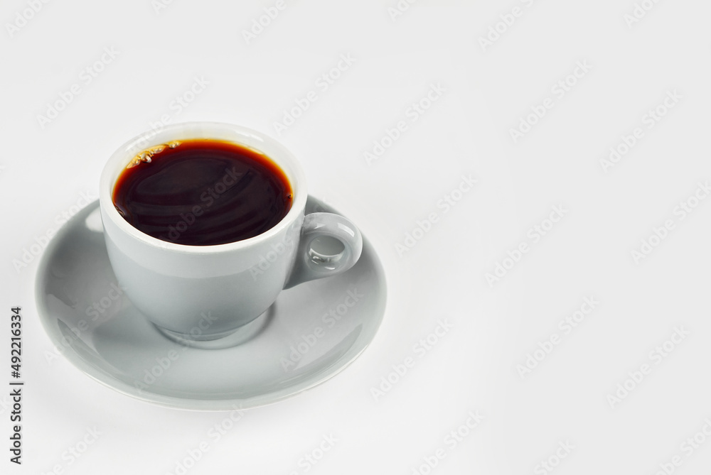 Ceramic coffee mug close up. Coffee isolated on a white background. Copy space and free space for text near the drink. Ceramic coffee mug close up. Coffee isolated on a white background. Copy space and free space for text near the drink.
