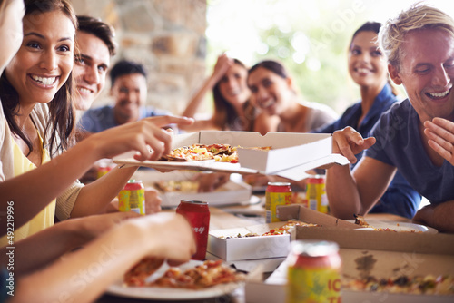 Good times with great pizza. Cropped shot of a group of friends enjoying pizza together.
