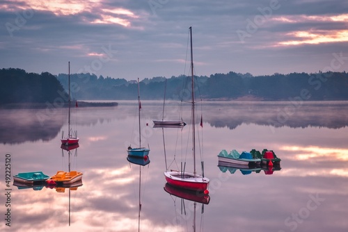 Beautiful morning landscape. Boats on the lake in the morning.