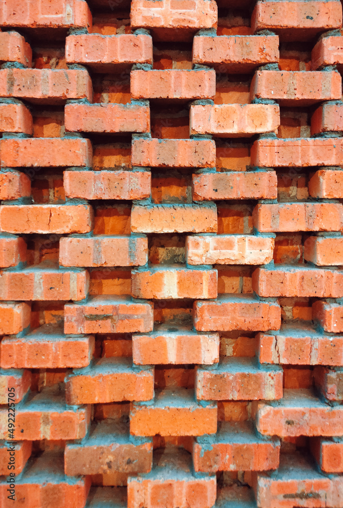 Brick wall design with hole between portrait background texture