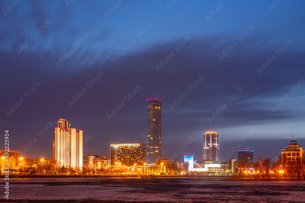 Fototapeta premium Early Spring night on the banks of the pond in the city center