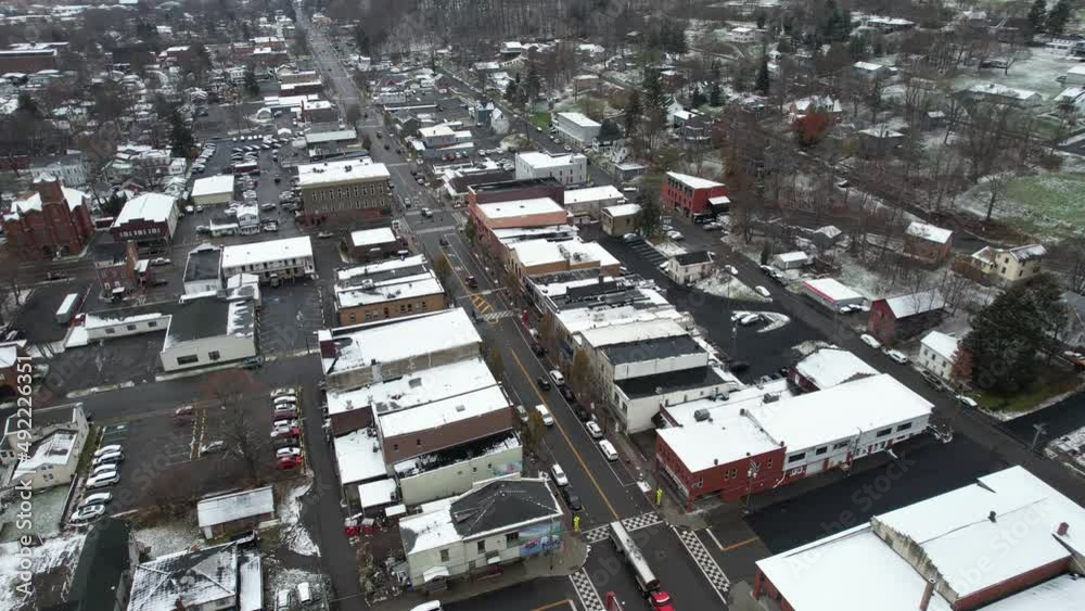 Aerial View of Central Streets and Buildings of Watkins Glen Village NY USA in Rinte Season, Snow Capped Roofs and Wet Roads - Drone Shot Aerial View of Central Streets and Buildings of Watkins Glen Village NY USA in Rinte Season, Snow Capped Roofs and Wet Roads - Drone Shot